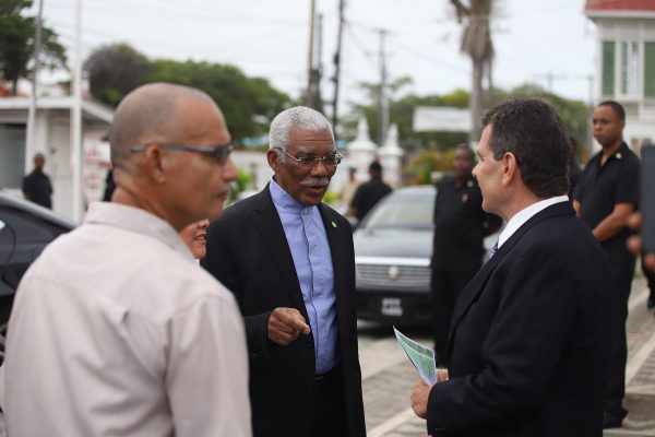 President David Granger and the Honorary Consul of Portugal Michael Correia Jr interact during the commemoration ceremony in honour of the 184th Anniversary of the arrival of the Portuguese in Guyana. 