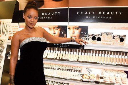 Rihanna and some of her Fenty products. (www.hollywoodreporter.com photo)