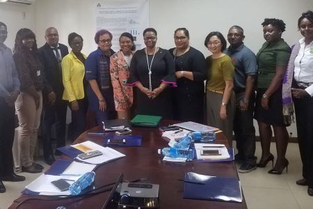 The Members of the Tobacco Control Council with Minister of Public Health Volda Lawrence (centre) at the meeting at the Health Sector Development Unit’s office on Camp Street.
