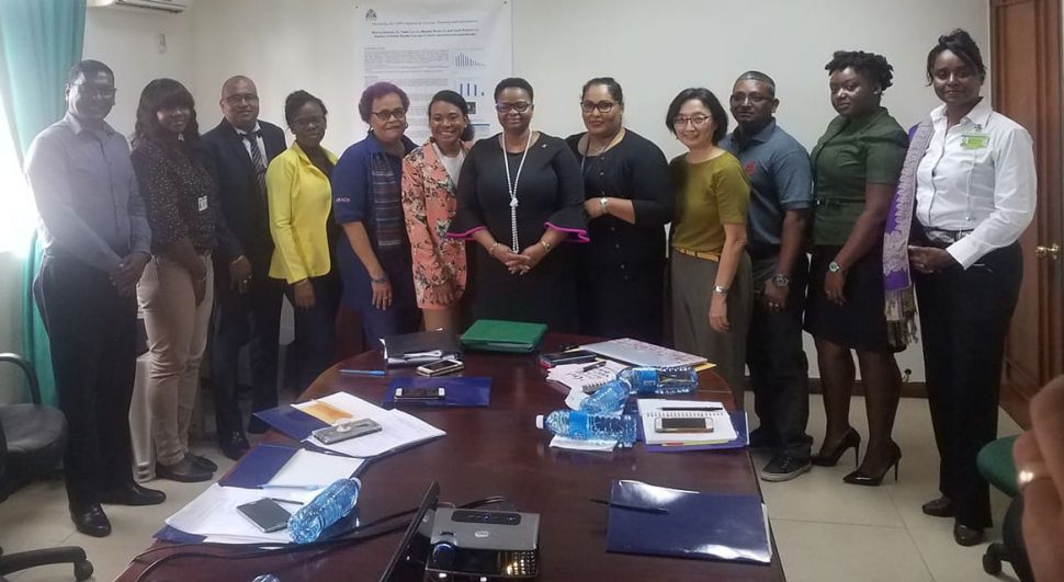 The Members of the Tobacco Control Council with Minister of Public Health Volda Lawrence (centre) at the meeting at the Health Sector Development Unit’s office on Camp Street. 

