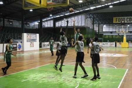Scenes from the Bishops’ High and St. Stanislaus College clash in the U18 section of the NSBF at the Cliff Anderson Sports Hall Friday.
