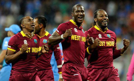 Dwayne Bravo (left) celebrates West Indies’ success at the 2016 T20 World Cup in India with fellow veterans Darren Sammy (centre) and Chris Gayle.
