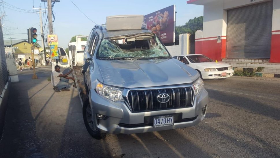 Security Minister, Dr Horace Chang's official vehicle somewhat smashed up after a collision at the intersection of Grants Pen Road and Shortwood Road in St Andrew on Wednesday morning.(Photos: Marlon Reid) 