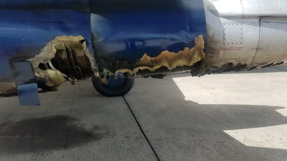 The damaged engine of tbe Venezolano flight which made an emergency landing at Piarco yesterday.