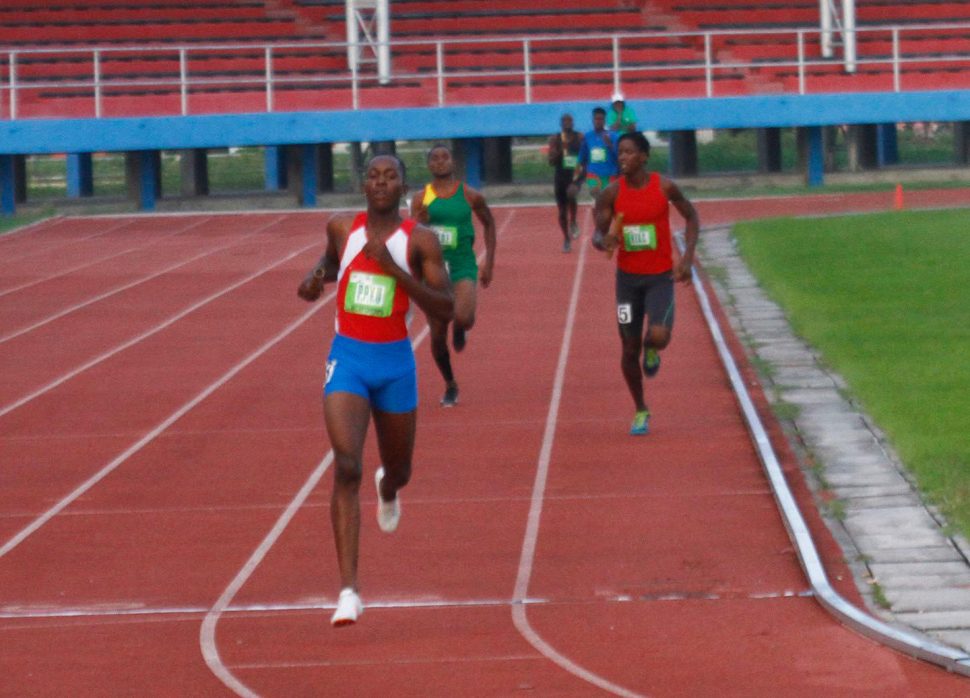 Winston Dummet’s blistering anchor leg overcame the heroics of Hopetown Flames’ Godwin Humphrey as the PPYC swept the last six events.(Orlando Charles photo)
