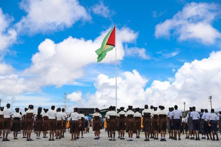 At 53: Schoolchildren standing at attention as the Golden Arrowhead was hoisted on Sunday to mark Guyana’s 53rd anniversary of Independence. The ceremony was held at D’Urban Park. (Department of Public Information photo)
