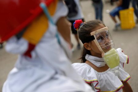 A girl wears a homemade gas mask during a rally against President Nicolas Maduro in Caracas, Venezuela. REUTERS/Carlos Garcia Rawlins