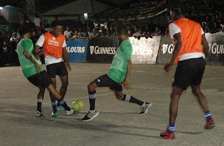 Flashback- Action in the quarterfinal round between Capital Storm [grebe] and Quiet Storm at the Mackenzie Market Tarmac in the Guinness ‘Greatest of the Streets’ Linden Championship
