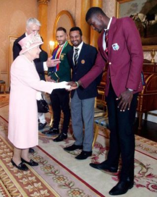 West Indies captain Jason Holder meets the Queen at Buckingham Palace yesterday. 