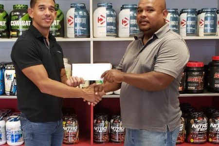 CEO of Fitness Express, Jamie McDonald (left) handed over a cheque of a substantial sum to Treasurer of the federation, Colin Austin to be the main sponsor of the Claude Charles Memorial Master’s and Intermediate Powerlifting Championships tomorrow.