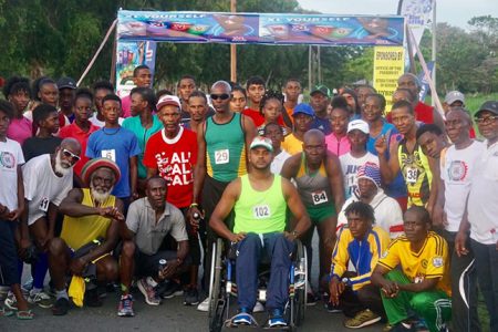 The athletes, officials, sponsors and organizers pose for a photo opportunity yesterday following the Rising Stars Independence 5K event in the National Park. (Emmerson Campbell photo)
