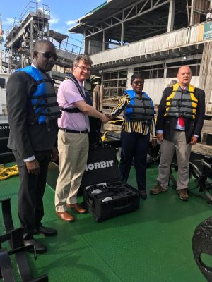 British High Commissioner Greg Quinn (second from left) hands over the Sonar Equipment to MARAD’s Director General, Claudette Rogers. They are flanked by Chief Executive Officer of the Guyana Lands and Surveys Commission, Trevor Benn (left) and Lead Trainer, Ian Davies (right).