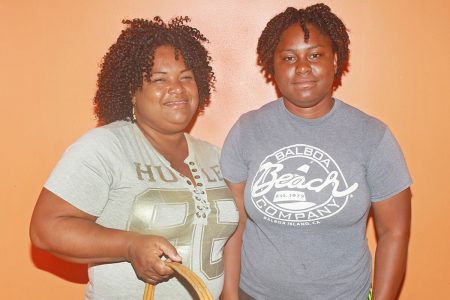 Nakeisha Simon, left, and daughter Makeisha Simon, 21 are selling nuts to raise funds after Makeisha was accepted to UWI for a bachelor’s degree in medicine and surgery starting in September.