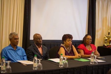 From left to right are:  FITUG General Secretary, Dawshan Nagasar, NACOSH Chairman, Earl Morris, Minister of Social Protection, Amna Ally and NACOSH Vice Chairman, Patricia Woolford. (DPI photo)