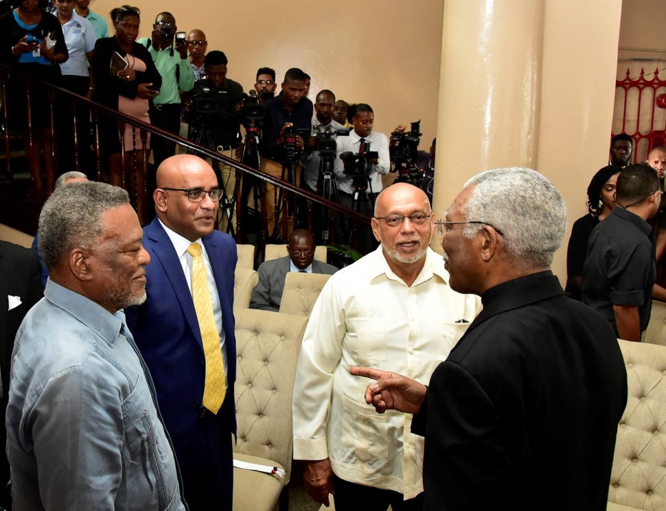 President David Granger (right)  and (going anti-clockwise) former Presidents Donald Ramotar, Bharrat Jagdeo and Samuel Hinds share a light moment after the ceremony to unveil the portraits of Presidents at Public Buildings. (Ministry of the Presidency photo)
