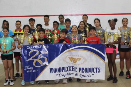 Winners of the 2019 Woodpecker Products Junior National Squash tournament pose with their spoils.