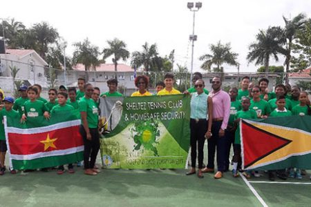 Organisers, sponsors and players from Guyana and Suriname take a photo opportunity before beginning the fourth edition of the Sheltez Independence tennis tournament.

