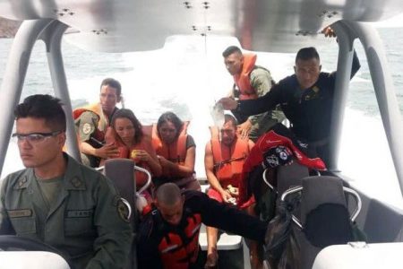 FLASBACK: Venezuelan authorites transport several Venezuelans who were rescued at sea after their vessel capsized on the way to Trinidad two weeks ago.