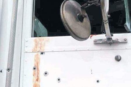 Bullet holes on a side of the truck. (Photo: Philp Lemonte) 