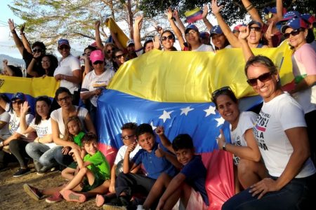 Venezuelan nationals living in Trinidad show solidarity for Operation Freedom at the Queen’s Park Savannah, Port-of-Spain, yesterday.