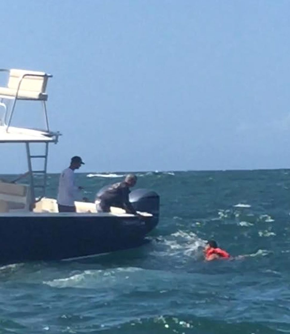 A Venezuelan national is rescued from the water on Thursday following the sinking of a vessel on the way from Venezuela to Trinidad and Tobago.