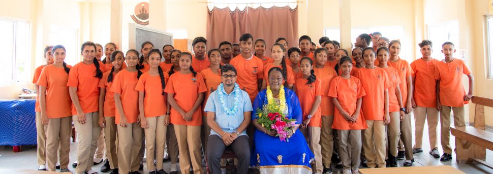 Minister within the Ministry of the Presidency with responsibility for Youth Affairs,  Simona Broomes and Mayor of Georgetown, Ubraj Narine along with the grades 10 and 11 students of the Valmiki Vidyalaya High School. (Ministry of the Presidency photo)