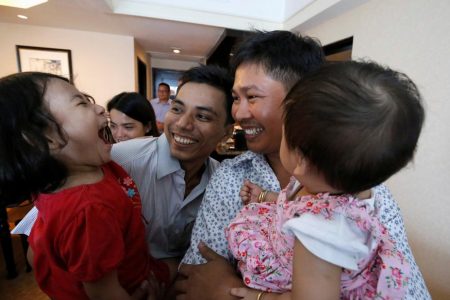 Reuters reporters Wa Lone and Kyaw Soe Oo celebrate with their children after being freed from prison, after receiving a presidential pardon in Yangon,  (Reuters photo)