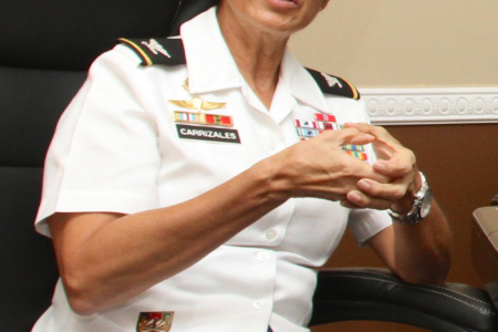 Colonel Clau­dia Car­riza­les