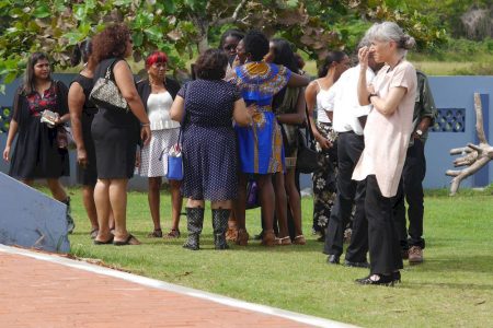 A group of women grieve the fallen stalwart
