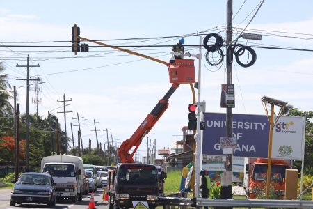 More cameras: Workers with SmartTech Solutions were yesterday seen installing CCTV cameras on the Railway Embankment at the corner of ‘UG Road’. 