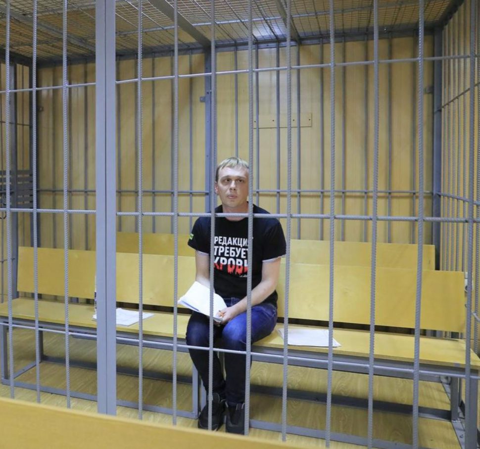 Russian investigative journalist Ivan Golunov, who was detained by police and accused of drug offences, inside a defendants’ cage at a court hearing in Moscow, Russia yesterday. (REUTERS/Tatyana Makeyeva)
