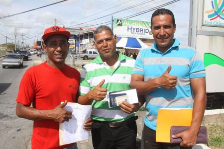 Car­los Mon­tesinos, Car­los Ed­uar­do Ro­driguez and Michael Alexan­der Perez Gar­cia  after successfully completing registration. (Trinidad Guardian photo) 