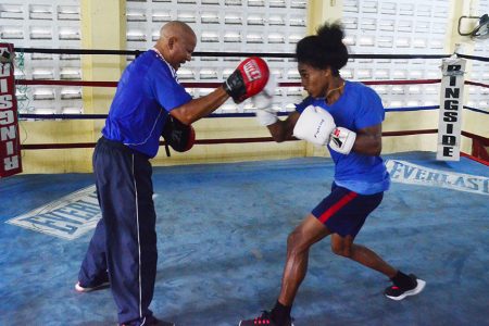 Boxing standout, Keevin Allicock going through his paces during a recent training session with Cuban Coach, Francisco Hernandez Roldan at the Andrew ‘Sixhead’ Lewis Boxing Gym. (Orlando Charles photo)

