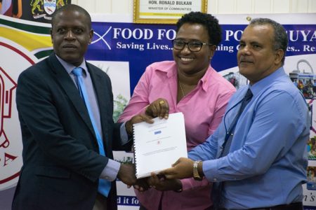 CH&PA’s Chief Executive Officer, Lelon Saul [left], Minister within the ministry of Communities with Responsibility for Housing, Annette Ferguson [centre] and Chief Executive Officer of FFTP, Kent Vincent presenting the signed MOU for the project. (DPI photo)
