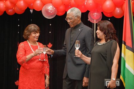 Canada’s 152nd: President David Granger (centre) shares a toast with Lilian Chatterjee (left), Canadian High Commissioner to Guyana while  Dawn Hastings-Williams, Minister of State looks on. The occasion was the 152nd Canada Day observance at the Marriott Hotel in Kingston. (Ministry of the Presidency photo)
