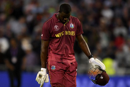 All-rounder Carlos Brathwaite trudges off after being dismissed with West Indies needing six runs for victory against New Zealand.
