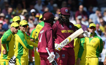 Chris Gayle (right) stands alongside partner Shai Hope after challenging his lbw decision by DRS during Thursday’s match against Australia at Trent Bridge. 