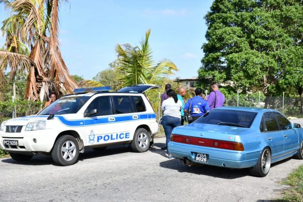 Police at the scene of the murder Thursday morning in Carlsen Field. Photo by Sashtri Boodan.