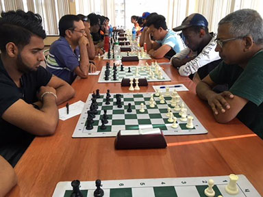 Dark Horses! In the 2019 National Chess Championship which began yesterday, Saeed Ali (left) and his opponent Loris Nathoo are regarded as the dark horses. Players to watch are Taffin Khan and Anthony Drayton. Beside Ali is Shiv Nandalall who recently came out of retirement and qualified for the National Championship with a five-point haul. 
