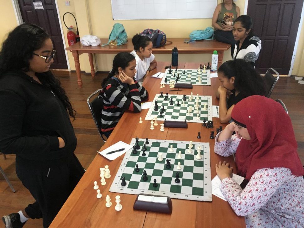 A section of the participants in the Women’s National Chess Championship this month at the Racquet Centre, Woolford Avenue. The number of women contestants was infinitesimal, compounding the unambiguous message that we should get more schools securely involved in chess. (Photo by Rashad Hussein) 