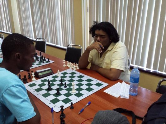 Anthony Drayton (left) and Taffin Khan during a previous encounter. The clash between the two could well determine a new national chess champion. If they play to a draw, and each has the identical number of points, the tie-break system would specify the winner.  