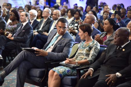 Prime Minister, the Most Hon. Andrew Holness (third right), engages with Minister of Foreign Affairs and Foreign Trade, Senator the Hon. Kamina Johnson Smith (centre), at the opening ceremony for the Eighth Biennial Jamaica Diaspora Conference at The Jamaica Pegasus Hotel in New Kingston on Sunday 