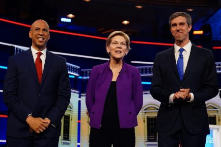 From left: U.S. Senator Cory Booker, U.S. Senator Elizabeth Warren and former U.S. Rep. Beto O'Rourke pose together before the start of the first U.S. 2020 presidential election Democratic candidates debate in Miami, Florida, U.S., June 26, 2019. REUTERS/Carlo Allegri