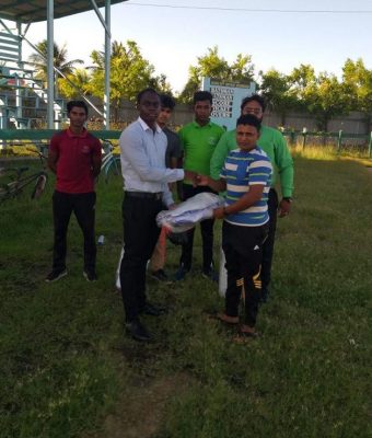 BCB PRO Simon Naidu (right) hands over cricket gears to a member of the UGBC elites in the presence of members of the Rose Hall Town Youth and Sports Club