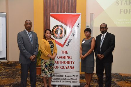 Minister of State,  Dawn Hastings-Williams (second from left), along with members of the Gaming Authority, Chief Executive Officer,  Lloyd Moore (left); Director, Christine King (second from right); Chairman, Gaming Authority, Roysdale Forde at the Forum. (Ministry of the Presidency photo)