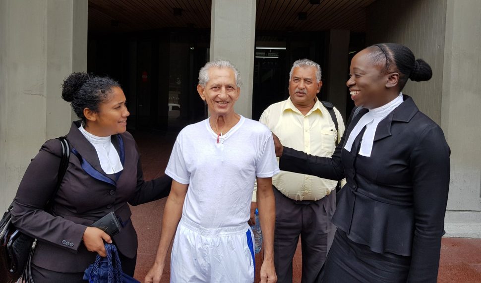 Azaad Ali, centre, is greeted by his attorneys Keisha Peters, left, and Renee Joseph at the Hall of Justice in Port-of-Spain, yesterday, after being freed after spending almost four months in prison in a mistaken identity case. Looking on is Ali’s brother Anthony Marciano. (Photo: Trinidad Guardian)