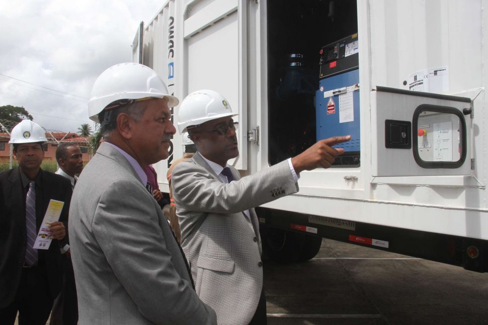 Minister of Public Utilities Robert Le Hunte takes a closer look at at the new T&Tec Mobile Substation machinery.