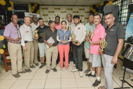 The various winners pose with their prizes at the end of the Macorp Golf Extravaganza Saturday at the Lusignan Golf Club course.
