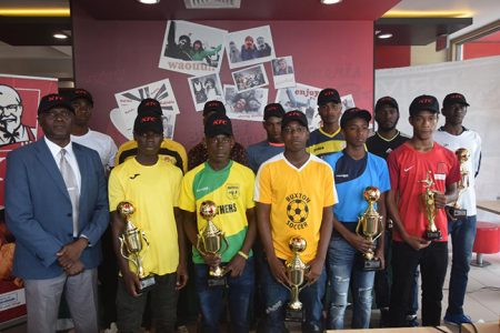 The respective representatives of the competing clubs pose with their spoils from the zonal tournaments ahead of the official draw of the National Championship leg of the KFC Independence U20 Club Knockout Football Cup
