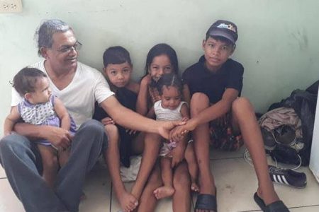 Dr Rampersad Lutchman with Venezuelan migrant children. The three older ones are the children of Evelyn Mata Rojas who was killed on June 7.